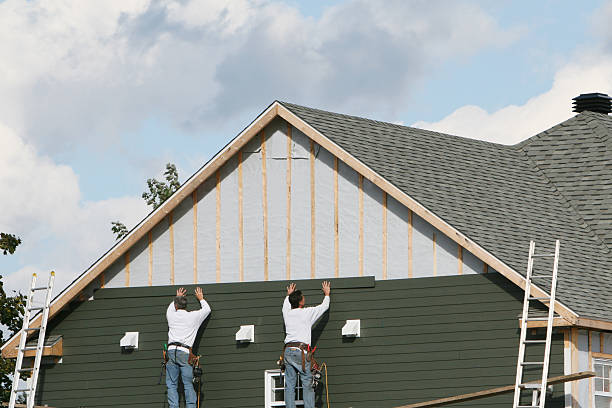 Professional Siding Replacement technician working in Greenlawn, NY